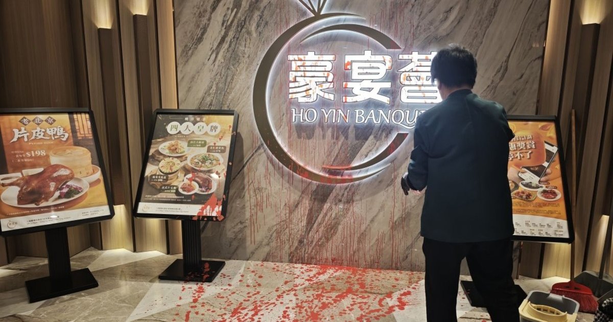 Two held over paint attacks on eateries