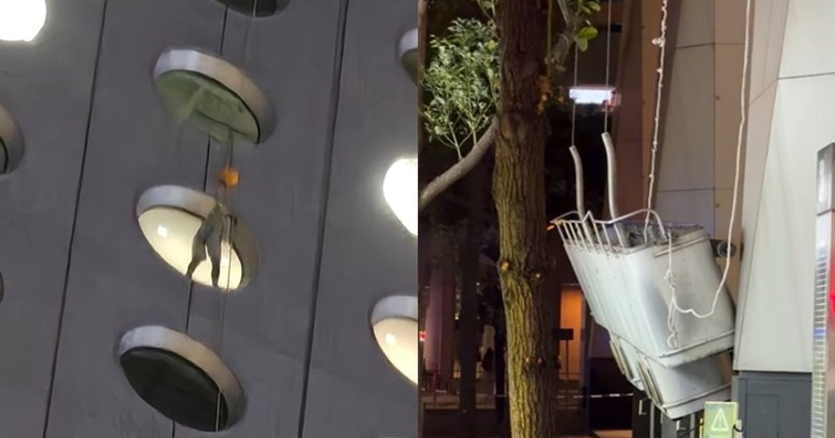 Two workers stranded on Jardine House facade